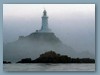 Faro con nebbia