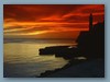 Faro nel cielo rosso